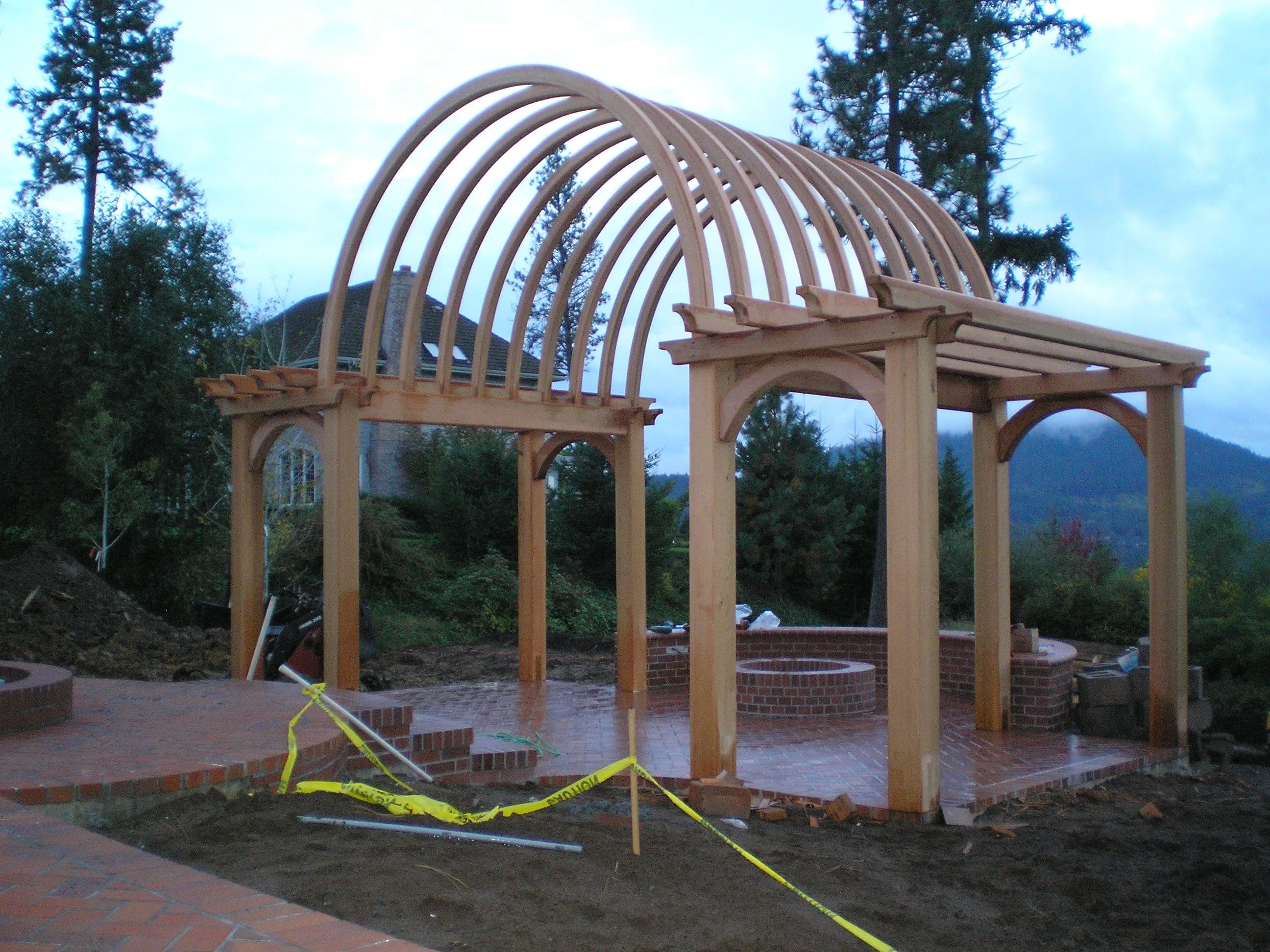 John Lee 
Clear Cedar Laminated Wood Trellis 
Curving Beams
Cedar Mill Deck Company
John B Breiling